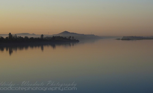 Dawn breaks through the mist on the Nile, near Komombo